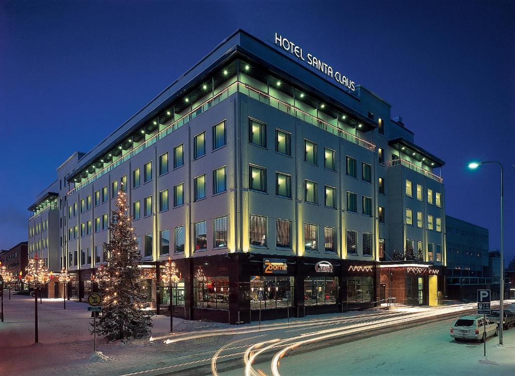 Street frontage of a town hotel with snow banked along the pavement